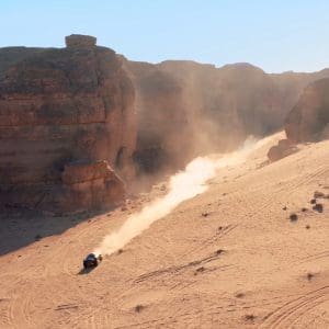 car driving through dessert