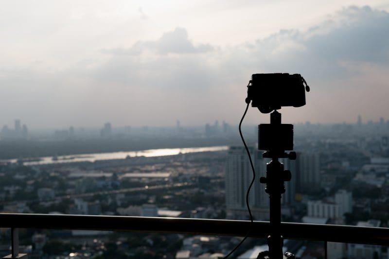 Camera on tripod, recording the city.